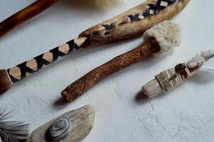 Shamanic objects. Tambourine beaters, a speaker's stick, noise makers. Ethnic Items photo