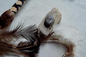 Shamanic objects. Tambourine beaters, a speaker's stick, noise makers. Ethnic Items photo