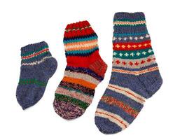 Knitted socks isolated on white background. Warm multi-colored wool sock. Set photo