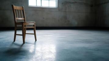 Wooden chair isolated in spacious empty room with soft daylight and rustic walls photo
