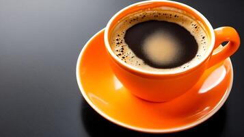 Vibrant Orange Cup of Freshly Brewed Espresso on Black Background photo