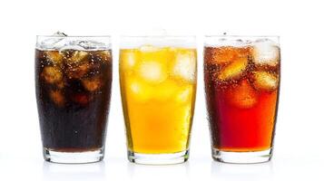 Assorted Chilled Soft Drinks with Ice Cubes in Glasses on Bright White Background photo