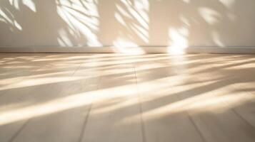 Sunlight casting shadows of leaves on wooden floor creating soothing natural pattern photo