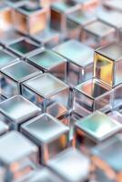 Array of small metallic cubes in various shades and shapes, arranged neatly on top of each other with holographic colors and reflections creating intricate patterns. photo