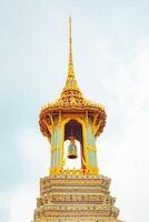 A golden temple roof in Bangkok, showcasing intricate architecture and traditional, Wat Phra Kaew, Thailand. photo