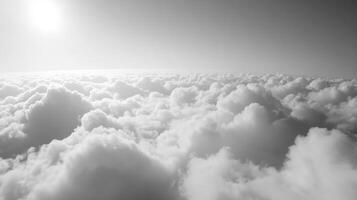 Monochrome Expansive Cloudscape with Sunlight Creating a Dreamlike Atmosphere photo