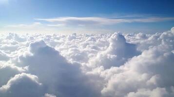 Awe Inspiring View of Fluffy White Clouds in Sunny Blue Sky Captured From Above in Aerial Photo