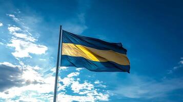 Vibrant National Flag with Yellow Stripe Against Blue Sky in a Majestic Display photo
