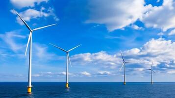 Offshore Wind Turbines Against a Backdrop of Vibrant Blue Sky and Gentle Clouds photo