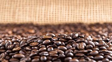 Close Up of Freshly Roasted Coffee Beans with Textured Burlap Backdrop photo
