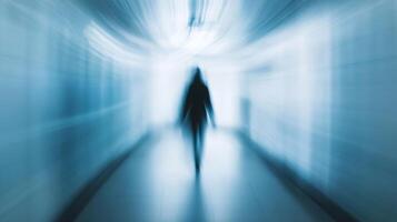 Mysterious Outlines of a Figure in a Blurred Blue Corridor Creating a Sense of Wonder photo