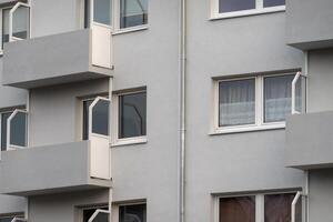Modern apartment building facade showing balconies and windows photo