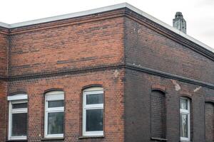 Corner of old building showing signs of ageing and wear photo