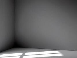Empty room corner with window light creating shadows on floor photo