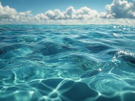 A serene view of rippling ocean water under a bright sky with fluffy clouds. photo