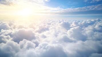 Sunlit Sky Above Clouds with Expansive View of Fluffy White Cloudscape photo