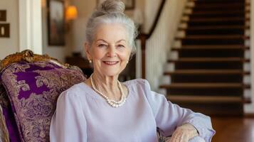 Elderly woman in elegant attire sitting on armchair at home interior setting photo