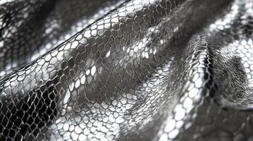 Metallic mesh fabric texture with interwoven patterns for background use photo