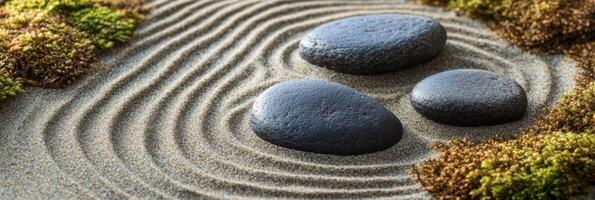 Smooth zen garden stones nestled in raked patterns with lush green moss photo
