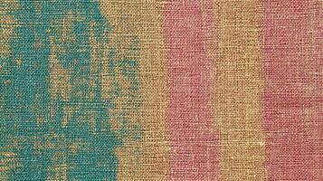 Textured abstract canvas with green, yellow, and red brush strokes photo