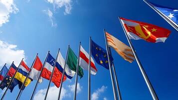 Rows of International Flags Against Clear Blue Sky Displaying Global Unity and Diversity photo