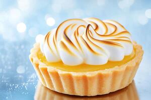 Delight in a mini lemon tart showcasing a golden crust filled with smooth lemon curd and topped with a beautifully toasted meringue against a glossy reflective surface photo