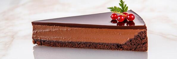 Decadent dark chocolate mousse cake with glossy ganache and fresh red currants on a polished surface photo