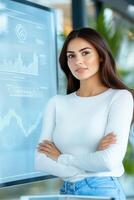 Woman presenting a business plan on a large screen in an innovative office setting with a dynamic team engaged in discussion photo