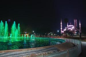 Nighttime View of Sultan Ahmed Mosque and Illuminated Fountain photo