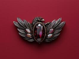 Ornate winged creature brooch with gemstone accents photo