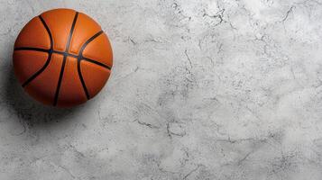 Close up of a basketball on a textured surface photo