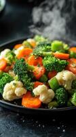 Steaming hot mixed vegetables of broccoli, carrots, photo