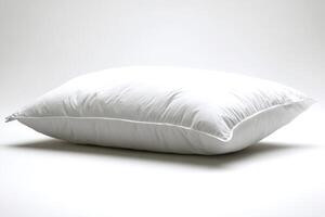 Comfortable white pillow resting on white background promoting relaxation and sleep photo