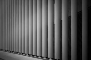 Shadows and lines created by architectural elements in a modern building during the daytime photo