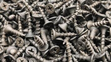 steel self-tapping screws for working with wooden products banner , self-tapping screws for attaching objects to wooden objects, for repair work, hardware store, construction, carpentry, joinery photo