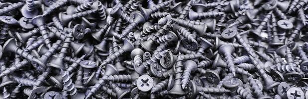 steel self-tapping screws for working with wooden products banner , self-tapping screws for attaching objects to wooden objects, for repair work, hardware store, construction, carpentry, joinery photo