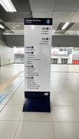 a sign for the subway station is displayed in a large building photo