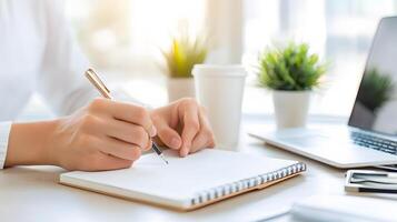 A close-up of hands writing goals in a notebook, with a background that symbolizes career progression and professional success photo