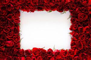 Red roses frame with square empty space white background for Valentine's and Mother day concept. photo