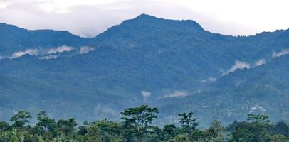 Nature mountains with dramatic clouds grey sky photo