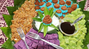 Colorfull traditional Indonesian snacks that is neatly and beautifully arranged photo