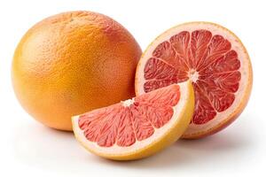 A Grapefruit with slices and leaves isolated on a white background photo