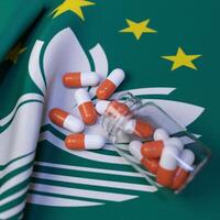 Flag of Macau With Pills and Capsules photo
