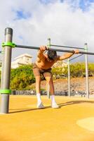A man is stretching and warming up during a work out photo