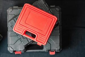 Stack of Tool Cases with Red Toolbox photo