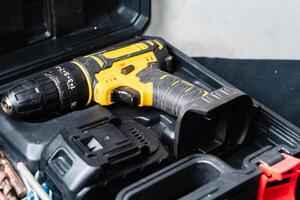 Cordless Yellow and Black Drill in Tool Case photo