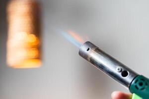 Close-up of a Torch Lighter with Flame photo
