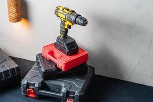 Cordless Drill on Tool Cases in Workshop photo