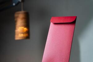 Elegant Red Envelope with Warm Lamp Background photo