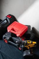 Stack of Toolboxes with Cordless Drill photo